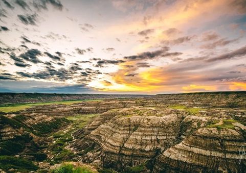 A view of the sky from above a large rock formation.
